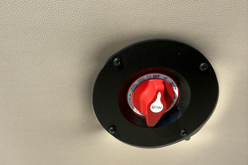 Slide: The Image of Red switch on Bentley Pontoons Legacy 223 Swingback 2026, mounted on beige surface. - 16