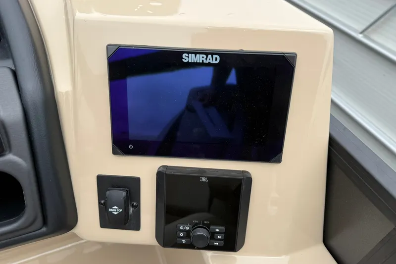 Slide: The Image of Control panel of 2026 Bentley Pontoons Legacy 223 Swingback with Simrad display and JBL audio. - 7