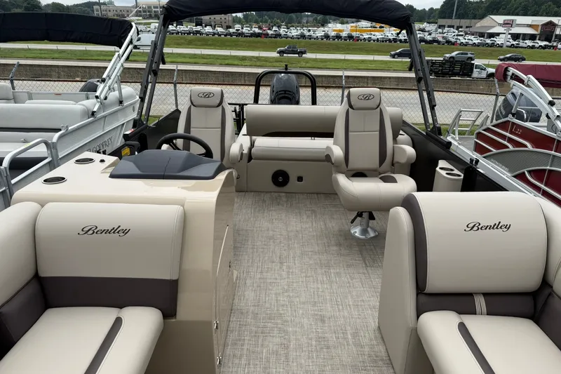 Slide: The Image of 2026 Bentley Pontoons Legacy 223 Swingback interior with luxurious seating and modern design. - 2