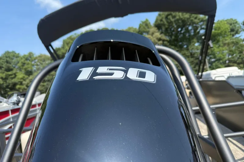 Slide: The Image of Close-up of a 2026 Bentley Pontoons Legacy 223 Swingback engine with "150" marking. - 10