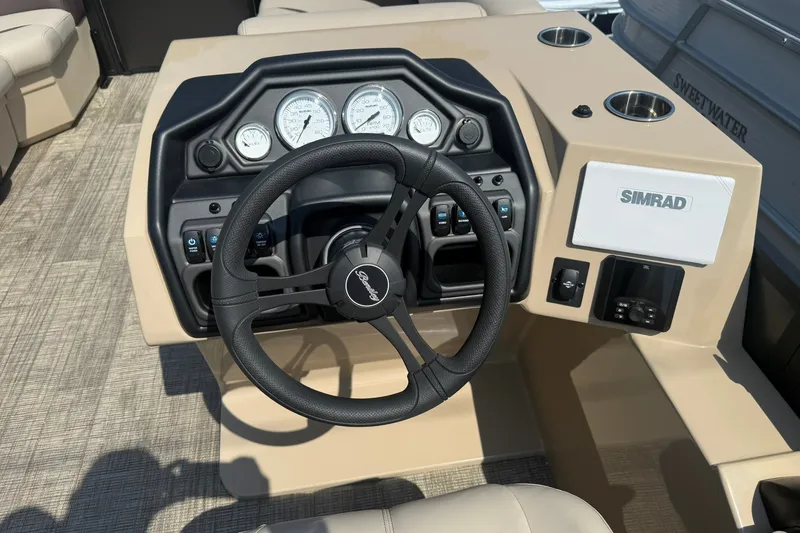 Slide: The Image of 2026 Bentley Pontoons Legacy 223 Swingback dashboard with steering wheel and Simrad display. - 5