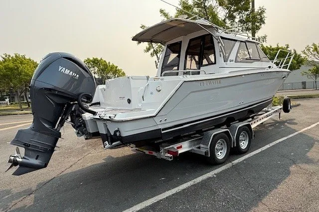 The Image of 2025 Cutwater C-248 Coupe boat on trailer with Yamaha outboard motor. - 0