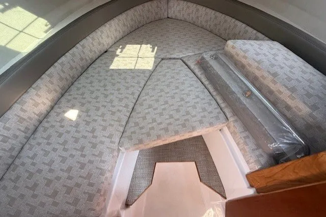 Slide: The Image of Interior view of 2025 Cutwater C-248 Coupe boat with cushioned seating area. - 15