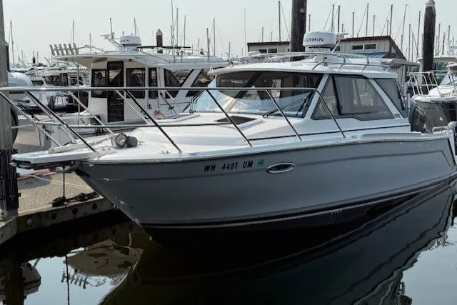 The Image of 2025 Cutwater C-248 Coupe boat docked at marina, sleek design, modern features. - 4