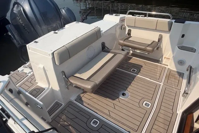 Slide: The Image of 2025 Cutwater C-248 Coupe boat interior with foldable seating and teak-style flooring. - 18