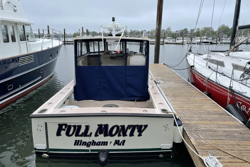 Slide: The Image of 1997 General Marine 26 Downeast Cruiser docked in Hingham, MA marina. - 4