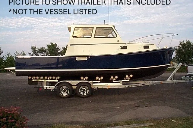Slide: The Image of 1997 General Marine 26 Downeast Cruiser on trailer, showcasing vessel's design and structure. - 5