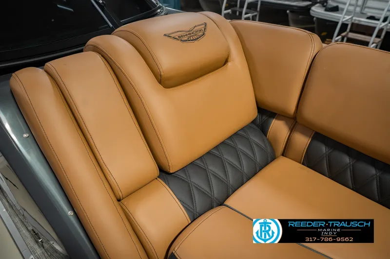 Slide: The Image of Luxurious tan and black seating in 2027 Bennington 23 RSWBA boat, showcasing premium craftsmanship. - 28