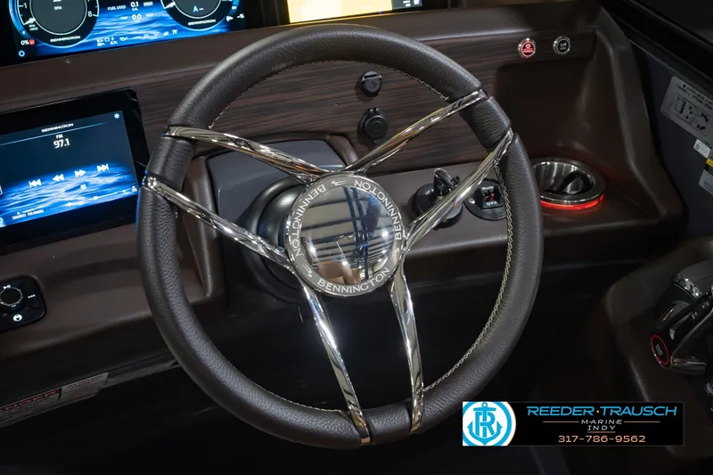 Slide: The Image of Steering wheel of 2027 Bennington 23 RSWBA boat with modern dashboard and controls. - 38