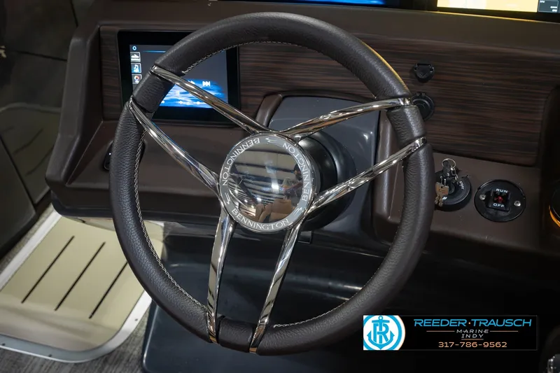 Slide: The Image of Steering wheel of 2027 Bennington 23 RSWBA boat with dashboard controls. - 37