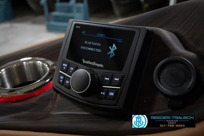 Slide: The Image of 2027 Bennington 23 RSWBA boat dashboard with Bluetooth-enabled Rockford Fosgate audio system. - 51