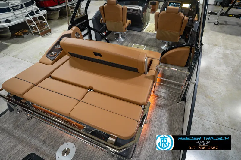 Slide: The Image of 2027 Bennington 23 RSWBA boat interior with tan seating and modern design. - 16