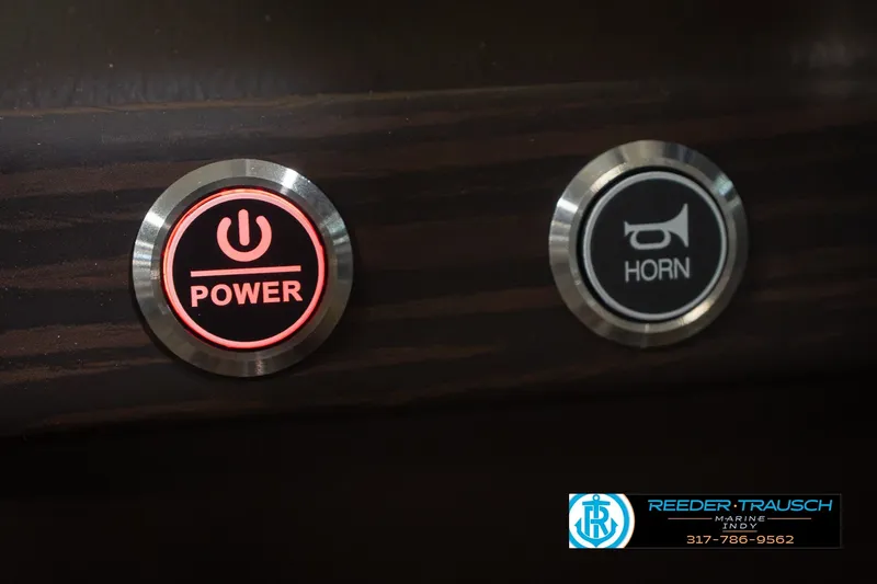 Slide: The Image of Power and horn buttons on 2027 Bennington 23 RSWBA boat dashboard. - 43