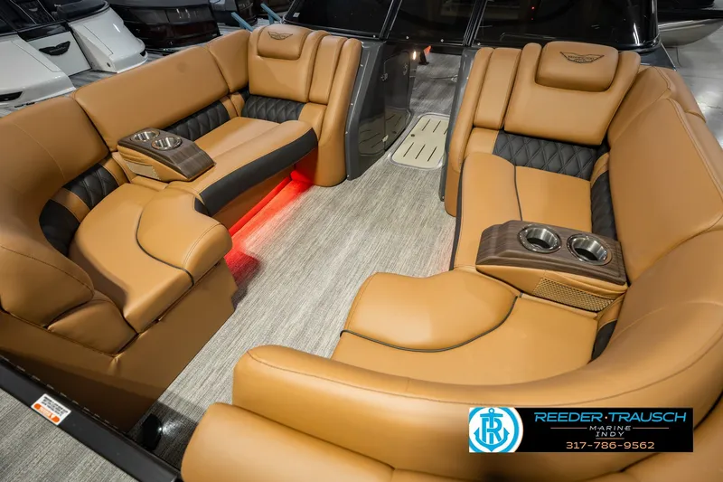 Slide: The Image of Luxurious interior of 2027 Bennington 23 RSWBA boat with tan leather seating and cup holders. - 13