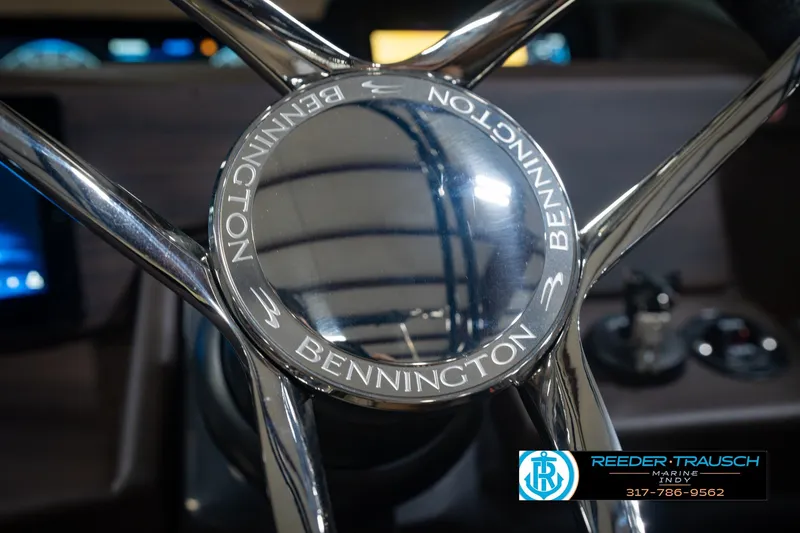 Slide: The Image of Steering wheel of 2027 Bennington 23 RSWBA boat, featuring chrome accents. - 39