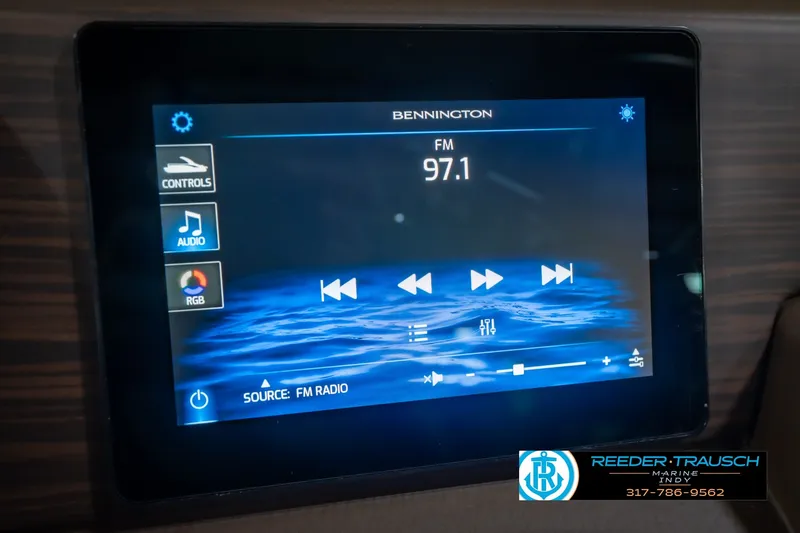 Slide: The Image of Touchscreen display of 2027 Bennington 23 RSWBA showing FM radio controls. - 40