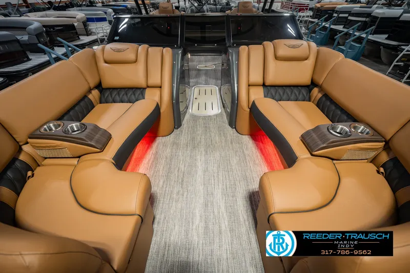 Slide: The Image of Luxurious interior of 2027 Bennington 23 RSWBA pontoon boat with tan seating and cup holders. - 18