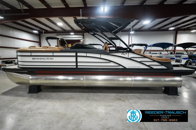 Slide: The Image of 2027 Bennington 23 RSWBA pontoon boat in showroom, side view. - 12