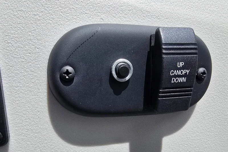 Slide: The Image of 2024 Godfrey Sweetwater 2286 SBC canopy control switch, labeled "Up Canopy Down." - 12