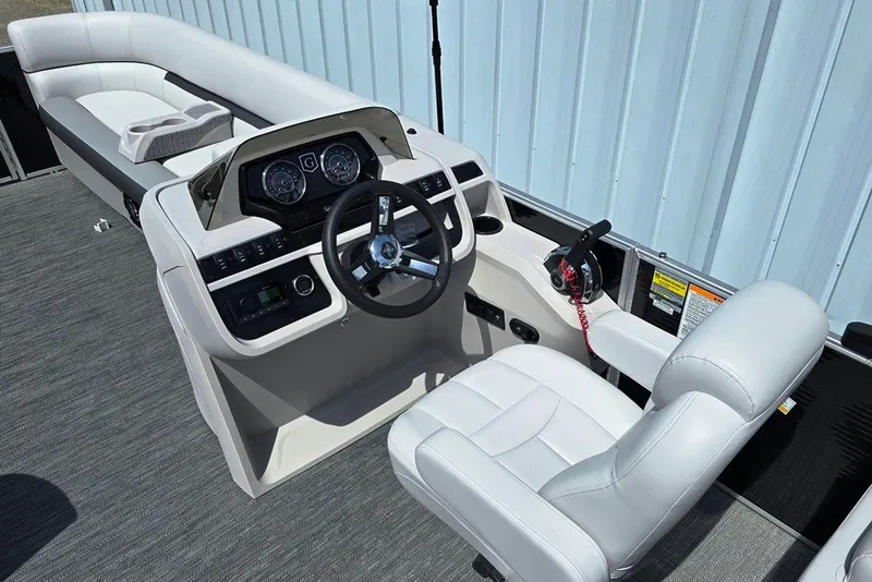 Slide: The Image of 2024 Godfrey Sweetwater 2286 SBC boat interior with steering console and seating. - 3