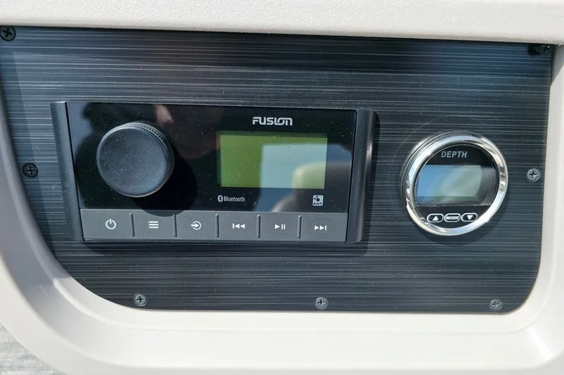 Slide: The Image of Control panel of 2024 Godfrey Sweetwater 2286 SBC boat with Fusion audio system. - 11