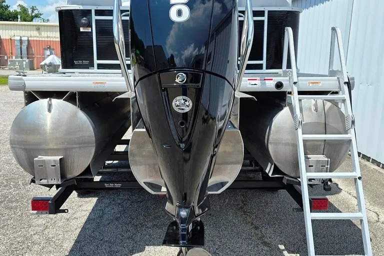 Slide: The Image of 2024 Godfrey Sweetwater 2286 SBC boat with triple tube deck and powerful outboard motor. - 6