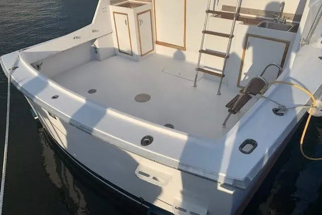 Slide: The Image of 1968 Hatteras 38 Convertible boat deck with ladder and storage compartments. - 12