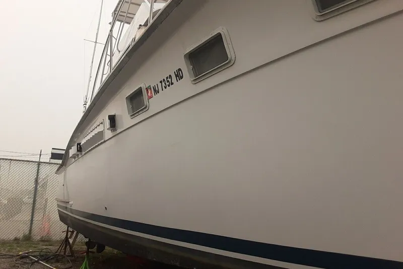 Slide: The Image of 1968 Hatteras 38 Convertible boat on dry dock, side view. - 15