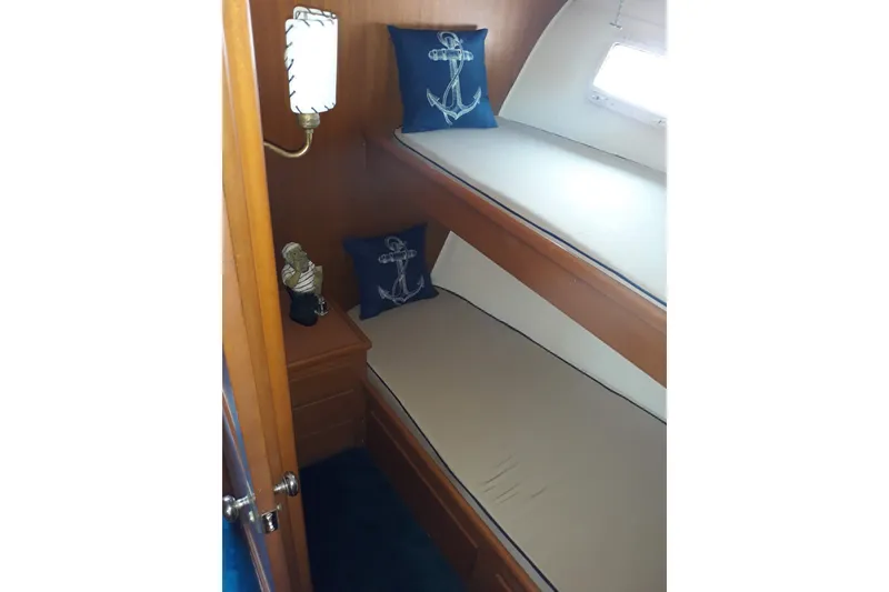 Slide: The Image of Cozy cabin interior of 1968 Hatteras 38 Convertible with nautical-themed decor. - 5