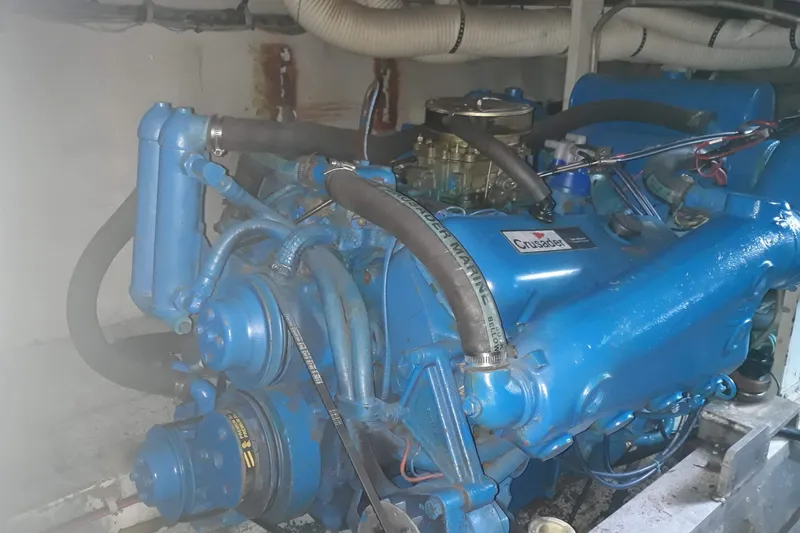 Slide: The Image of Engine of a 1968 Hatteras 38 Convertible boat, featuring a blue Crusader marine engine. - 20