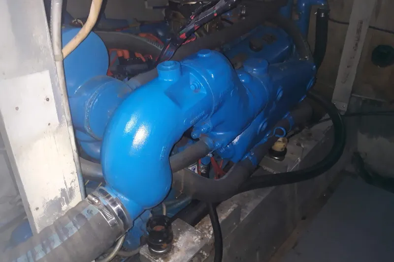 Slide: The Image of Engine compartment of a 1968 Hatteras 38 Convertible with blue-painted components. - 18