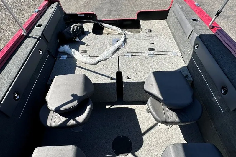 Slide: The Image of Interior view of a 2026 Starweld 18 SXT boat with seating and storage compartments. - 7