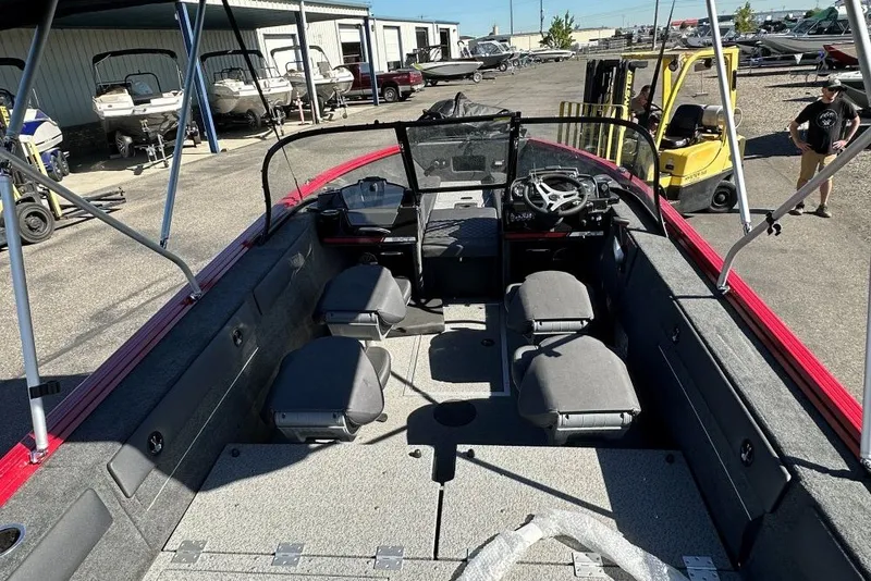 Slide: The Image of Interior view of a 2026 Starweld 18 SXT boat with seating and steering console. - 5