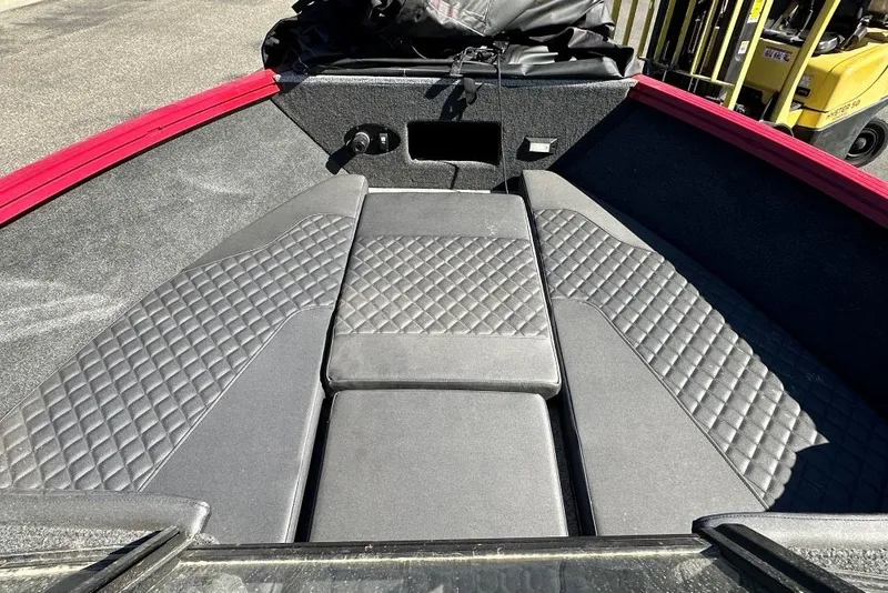 Slide: The Image of Interior view of a 2026 Starweld 18 SXT boat with quilted seating. - 6