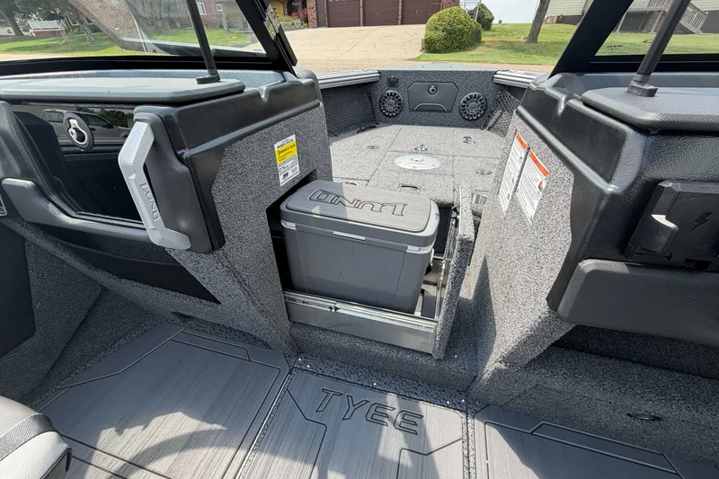 Slide: The Image of Interior of 2027 Lund 1975 Tyee boat with storage compartment and cooler. - 12