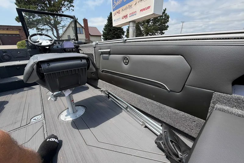 Slide: The Image of Interior of 2027 Lund 1975 Tyee boat with modern seating and dashboard. - 8