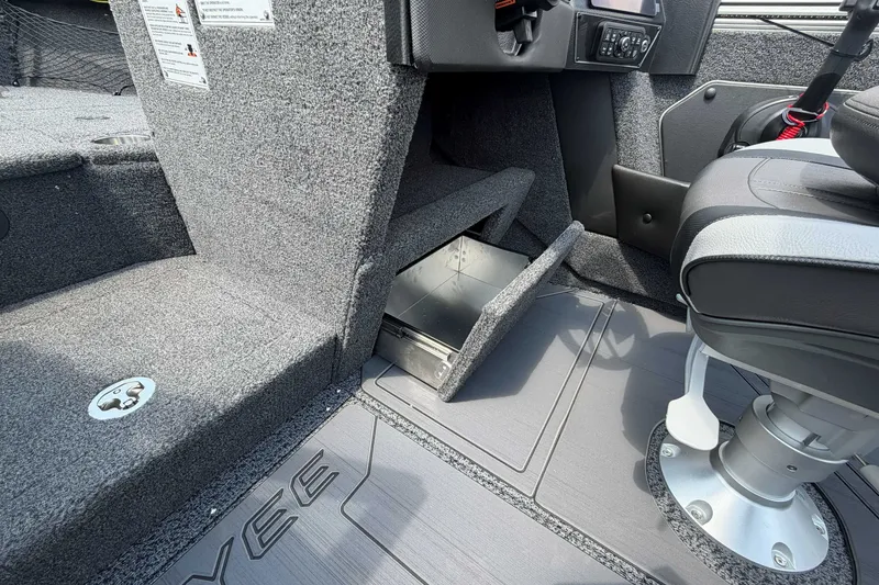 Slide: The Image of Interior of 2027 Lund 1975 Tyee boat showing storage compartment and seating. - 11