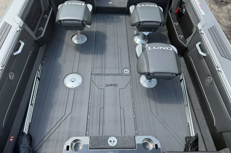 Slide: The Image of Interior of 2027 Lund 1975 Tyee boat with four seats and sleek design. - 6