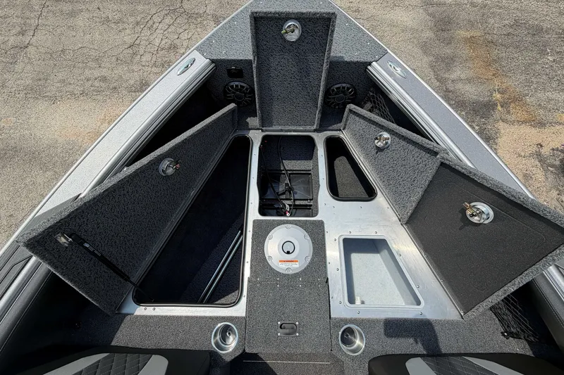 Slide: The Image of Interior view of 2027 Lund 1975 Tyee boat with open storage compartments. - 14