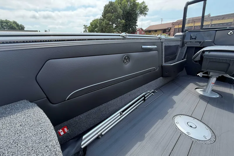 Slide: The Image of Interior of 2027 Lund 1975 Tyee boat, featuring sleek seating and modern design elements. - 7