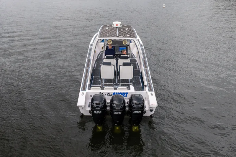 Slide: The Image of 2018 Fountain 38 Center Console boat with triple 350 engines on water. - 3