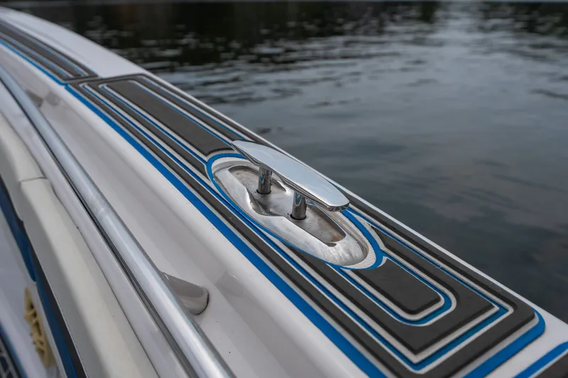 Slide: The Image of 2018 Fountain 38 Center Console boat detail with sleek design and water backdrop. - 45