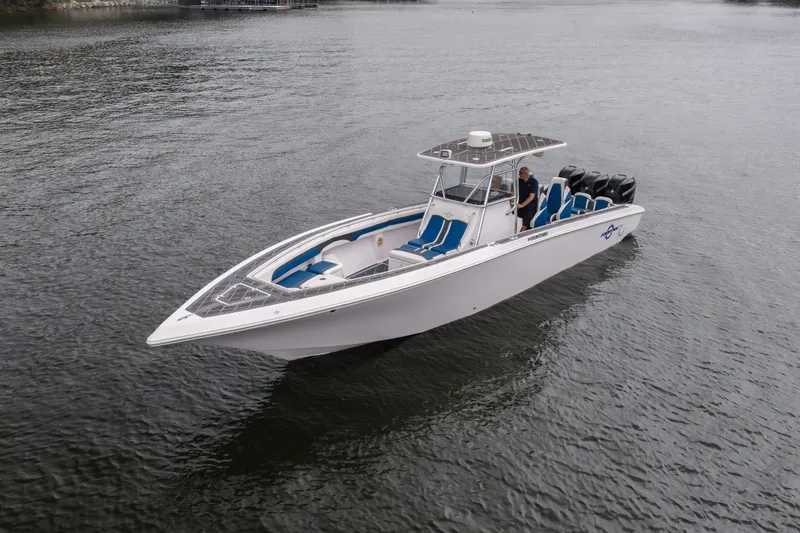 Slide: The Image of 2018 Fountain 38 Center Console boat on calm water, featuring sleek design and powerful engines. - 9