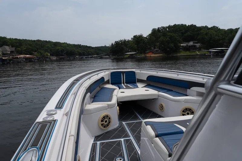 Slide: The Image of 2018 Fountain 38 Center Console boat with spacious seating on a serene lake. - 29