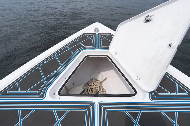 Slide: The Image of Open storage compartment on 2018 Fountain 38 Center Console boat deck. - 21