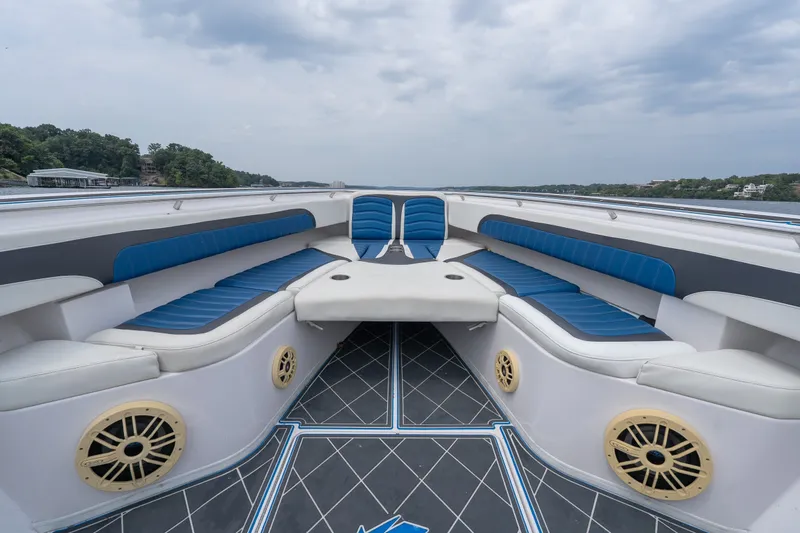 Slide: The Image of 2018 Fountain 38 Center Console boat interior with blue seating and stylish design. - 16