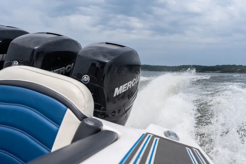 Slide: The Image of 2018 Fountain 38 Center Console boat with powerful Mercury engines on open water. - 26