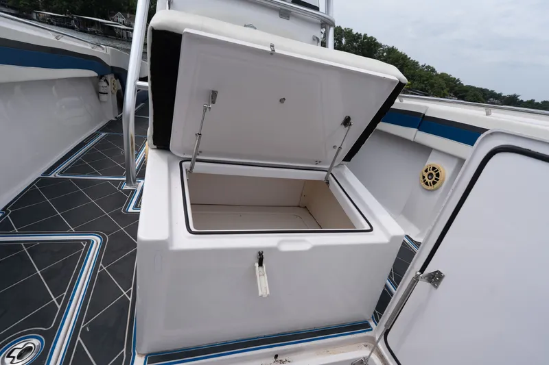 Slide: The Image of Open storage compartment on 2018 Fountain 38 Center Console boat deck. - 50