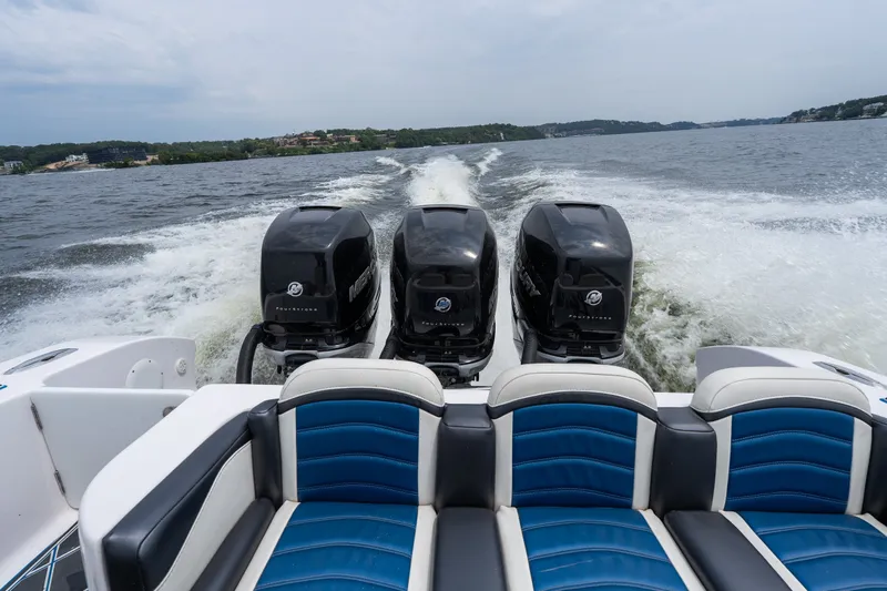 Slide: The Image of 2018 Fountain 38 Center Console boat with triple Mercury engines on open water. - 25