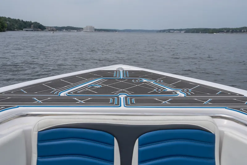 Slide: The Image of 2018 Fountain 38 Center Console boat on a lake, featuring stylish deck design. - 17